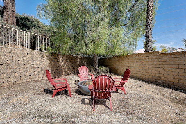 28097 Promontory Ln, Valencia, CA 91354 - fenced backyard with a fire pit and a patio