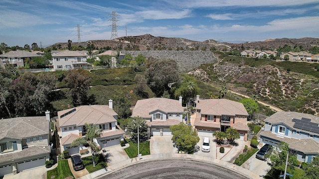 28097 Promontory Ln, Valencia, CA 91354 - aerial overview of property's location featuring nearby suburban area and a mountain backdrop