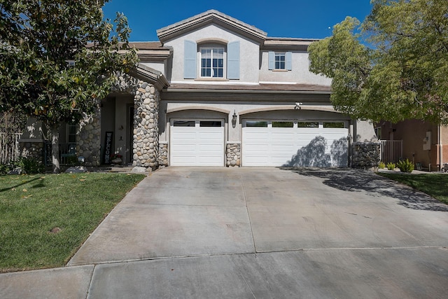 28097 Promontory Ln, Valencia, CA 91354 - view of front of house with stucco siding, a garage, stone siding, a front lawn, and concrete driveway