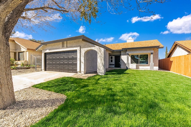 view of front of house featuring stucco siding, an attached garage, a front yard, fence, and driveway