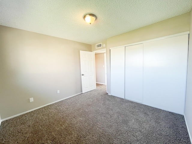 429 Peg St, Ridgecrest, CA 93555 - unfurnished bedroom featuring carpet floors, a textured ceiling, and a closet