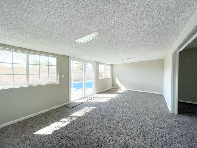 429 Peg St, Ridgecrest, CA 93555 - carpeted empty room with a textured ceiling and baseboards