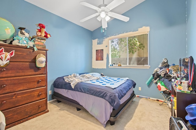 bedroom with ceiling fan, lofted ceiling, and light carpet