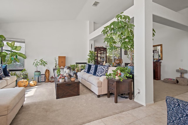 tiled living room with lofted ceiling