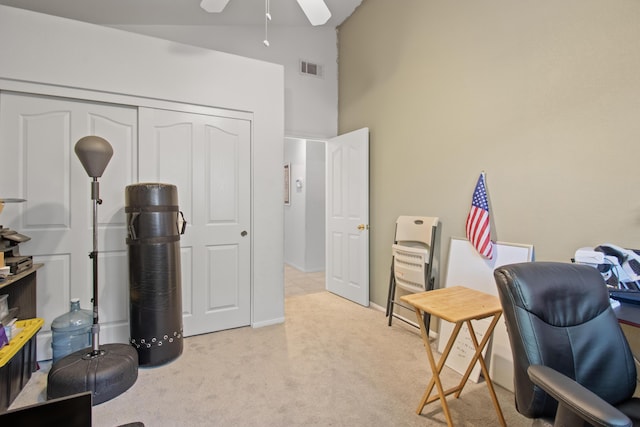 carpeted office with ceiling fan and lofted ceiling