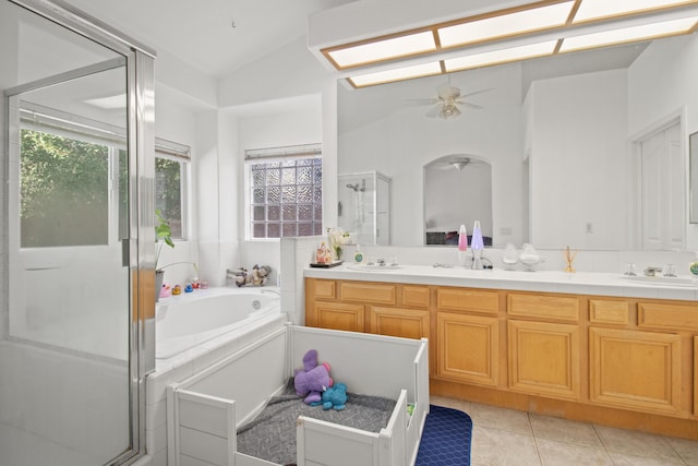 bathroom with ceiling fan, tile patterned floors, lofted ceiling, vanity, and independent shower and bath