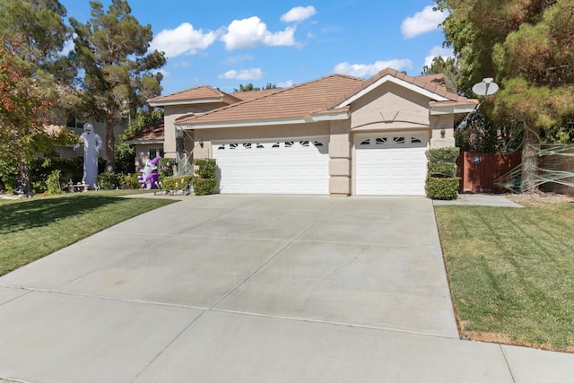 view of front facade featuring a garage and a front yard