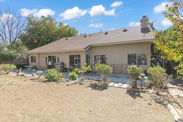 rear view of house with a patio area