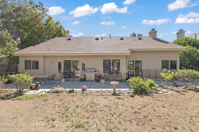 back of house featuring a patio area