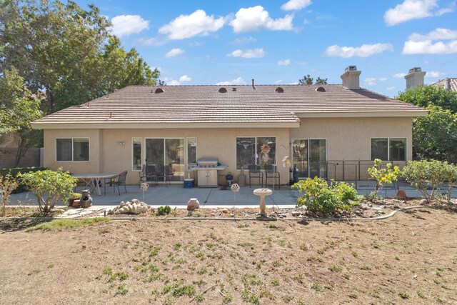 back of house featuring a patio area