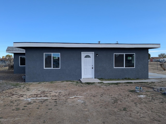 view of front of house featuring stucco siding