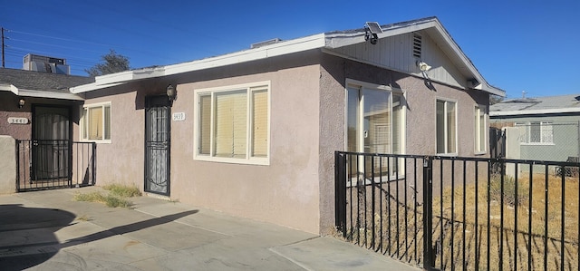 view of side of property with a patio