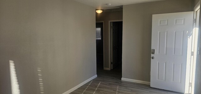 hallway featuring dark hardwood / wood-style floors