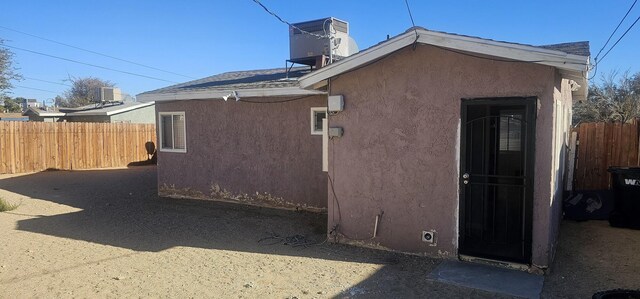 view of home's exterior with cooling unit