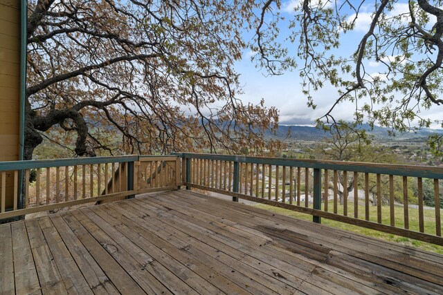wooden deck with a mountain view