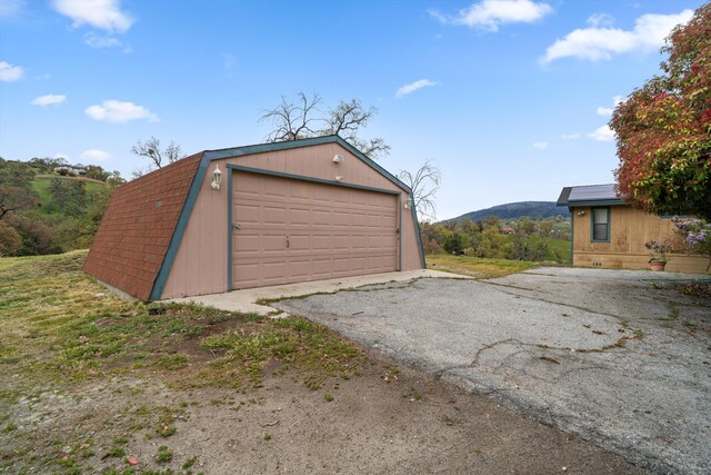 detached garage with a mountain view