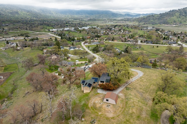 birds eye view of property featuring a mountain view