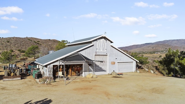 view of barn featuring a mountain view