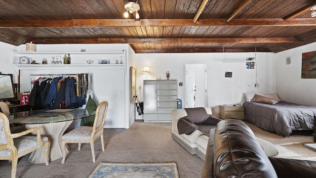 carpeted bedroom with wooden ceiling, beam ceiling, and visible vents