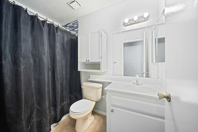 bathroom featuring vanity, curtained shower, and toilet