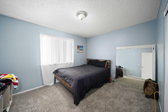 carpeted bedroom featuring a textured ceiling