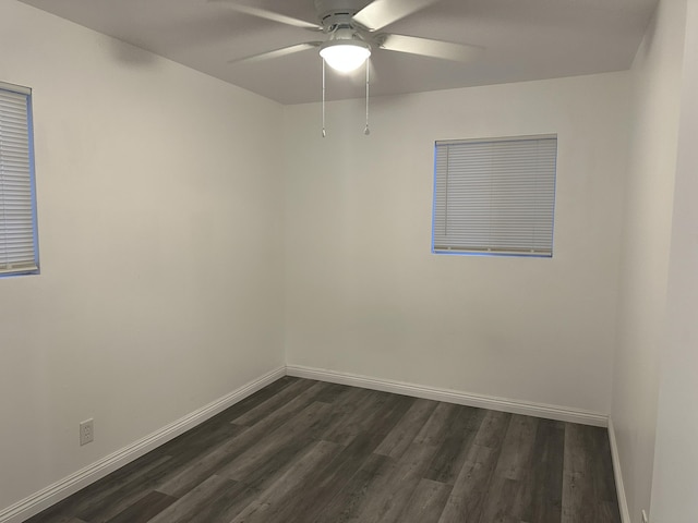 15284 Carol St, Mojave, CA 93501 - spare room featuring dark wood-style floors, ceiling fan, and baseboards