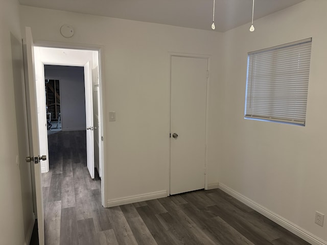 15284 Carol St, Mojave, CA 93501 - unfurnished bedroom with dark wood finished floors and baseboards