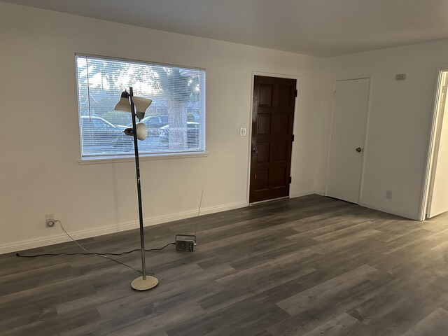 15284 Carol St, Mojave, CA 93501 - spare room with dark wood-type flooring and baseboards
