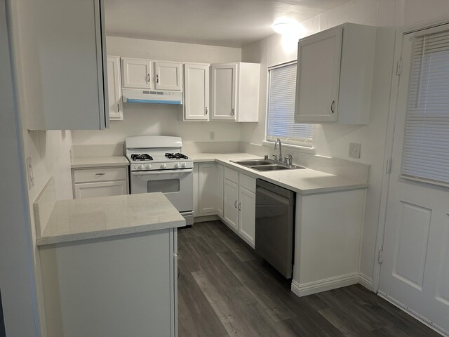 15284 Carol St, Mojave, CA 93501 - kitchen with white range with gas stovetop, a sink, dishwasher, under cabinet range hood, and dark wood-type flooring