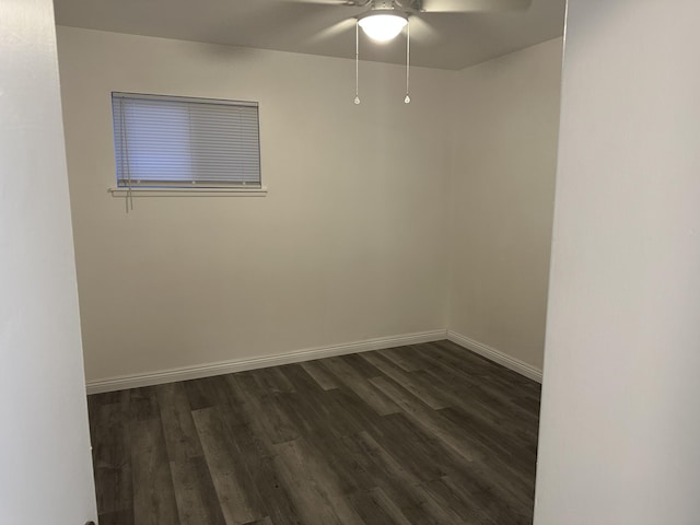 15284 Carol St, Mojave, CA 93501 - spare room featuring dark wood-style flooring, ceiling fan, and baseboards