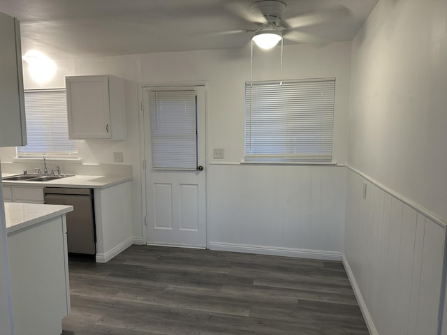 15284 Carol St, Mojave, CA 93501 - kitchen with a sink, stainless steel dishwasher, light countertops, ceiling fan, and dark wood finished floors