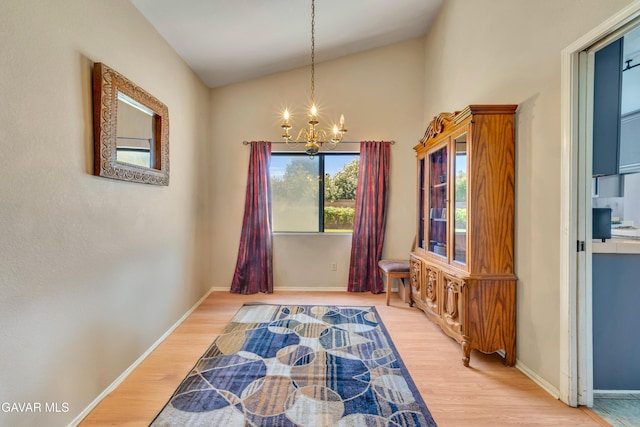 3628 Marilynn St, Lancaster, CA 93536 - dining area with a chandelier, lofted ceiling, and light wood finished floors