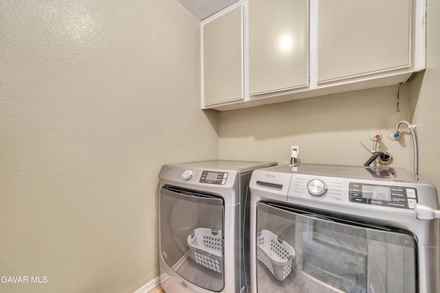 3628 Marilynn St, Lancaster, CA 93536 - laundry area featuring cabinet space and separate washer and dryer