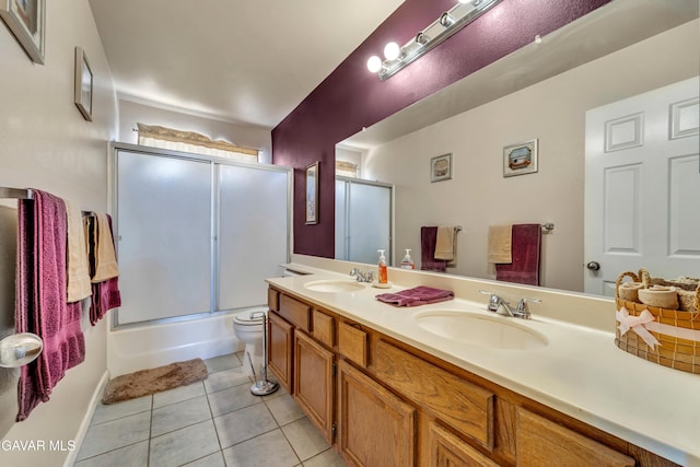 3628 Marilynn St, Lancaster, CA 93536 - full bathroom featuring double vanity, tile patterned flooring, and enclosed tub / shower combo