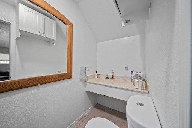 1510 W Newgrove St, Lancaster, CA 93534 - half bath with toilet, tile patterned floors, baseboards, and a sink
