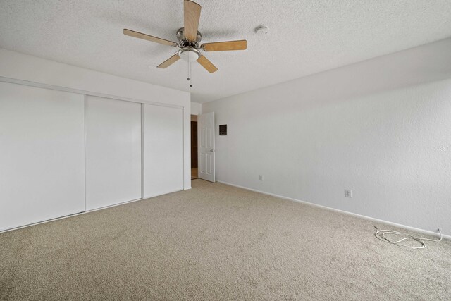 1510 W Newgrove St, Lancaster, CA 93534 - unfurnished bedroom with light colored carpet, a closet, a textured ceiling, and baseboards