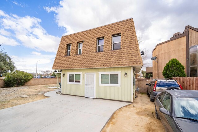 1510 W Newgrove St, Lancaster, CA 93534 - view of front of home with a shingled roof, mansard roof, and concrete driveway