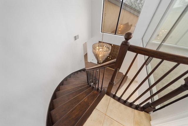 1510 W Newgrove St, Lancaster, CA 93534 - stairs featuring a chandelier and tile patterned flooring