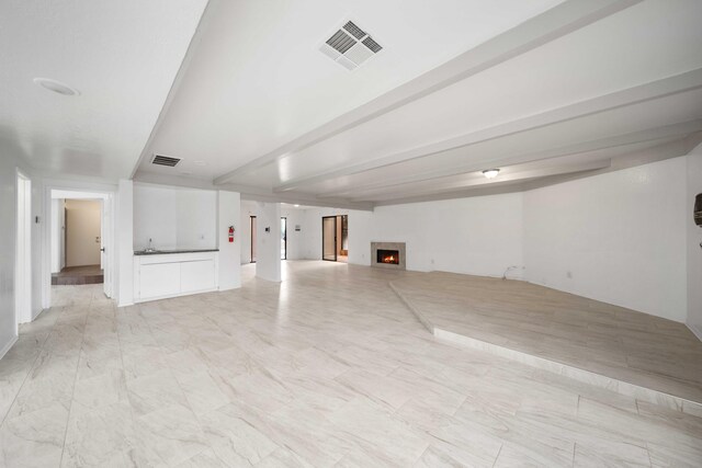 1510 W Newgrove St, Lancaster, CA 93534 - unfurnished living room with a lit fireplace
