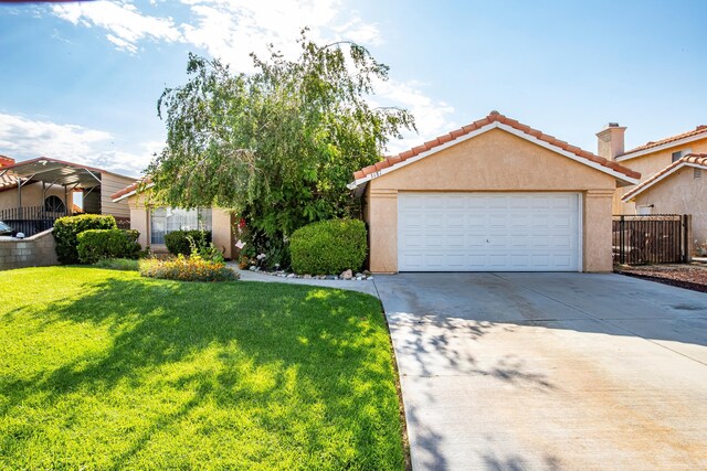 3181 Sabre St, Rosamond, CA 93560 - view of front facade featuring stucco siding, a garage, driveway, and a tiled roof