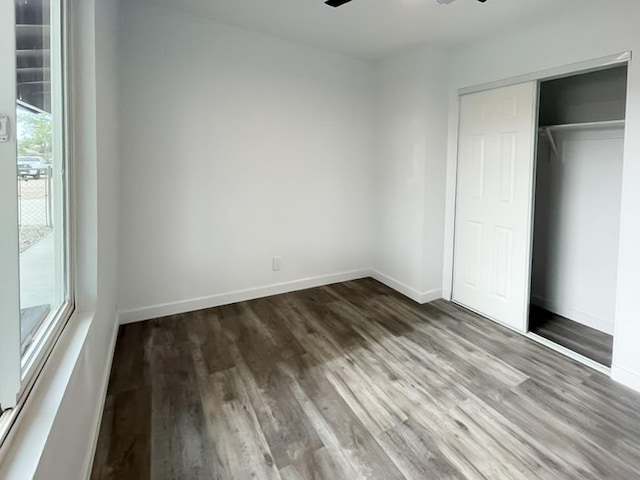40294 Fieldspring St, Palmdale, CA 93591 - unfurnished bedroom with wood finished floors, a closet, and baseboards