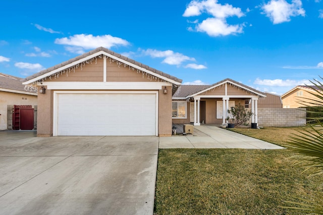 view of front of property featuring a garage and a front yard