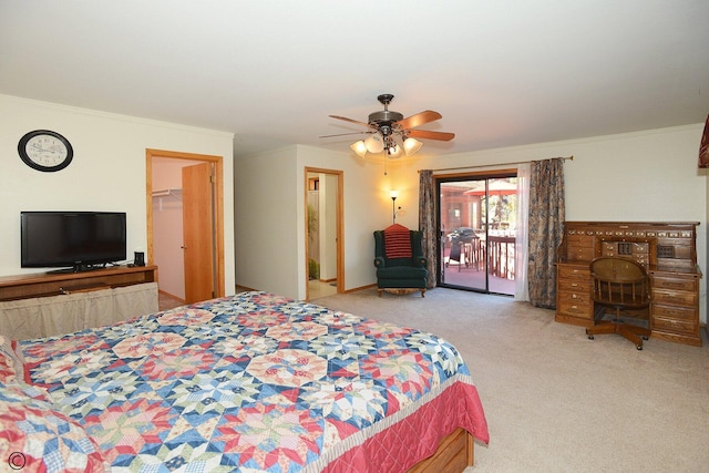 carpeted bedroom with access to exterior, a walk in closet, ceiling fan, and crown molding