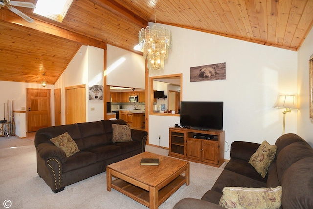 carpeted living room with high vaulted ceiling, wood ceiling, and an inviting chandelier