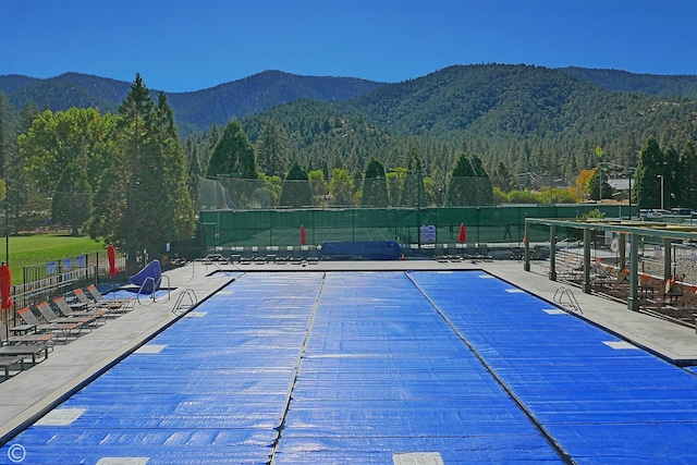 view of swimming pool featuring a mountain view