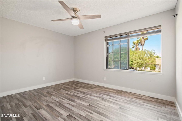 37623 E 49th St, Palmdale, CA 93552 - empty room with wood finished floors, a textured ceiling, and a ceiling fan