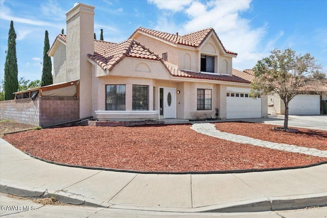37623 E 49th St, Palmdale, CA 93552 - mediterranean / spanish-style home with a tiled roof, driveway, stucco siding, a chimney, and an attached garage