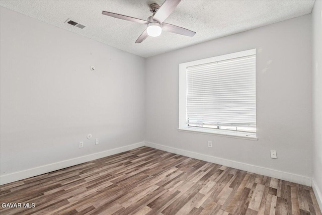 37623 E 49th St, Palmdale, CA 93552 - spare room with ceiling fan, wood finished floors, and a textured ceiling