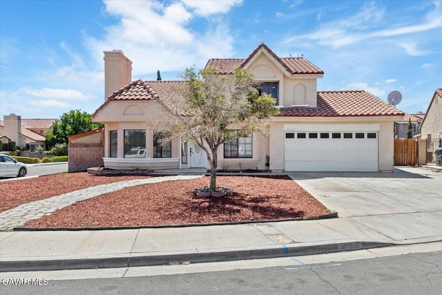 37623 E 49th St, Palmdale, CA 93552 - mediterranean / spanish-style home with a tile roof, concrete driveway, a garage, a chimney, and stucco siding