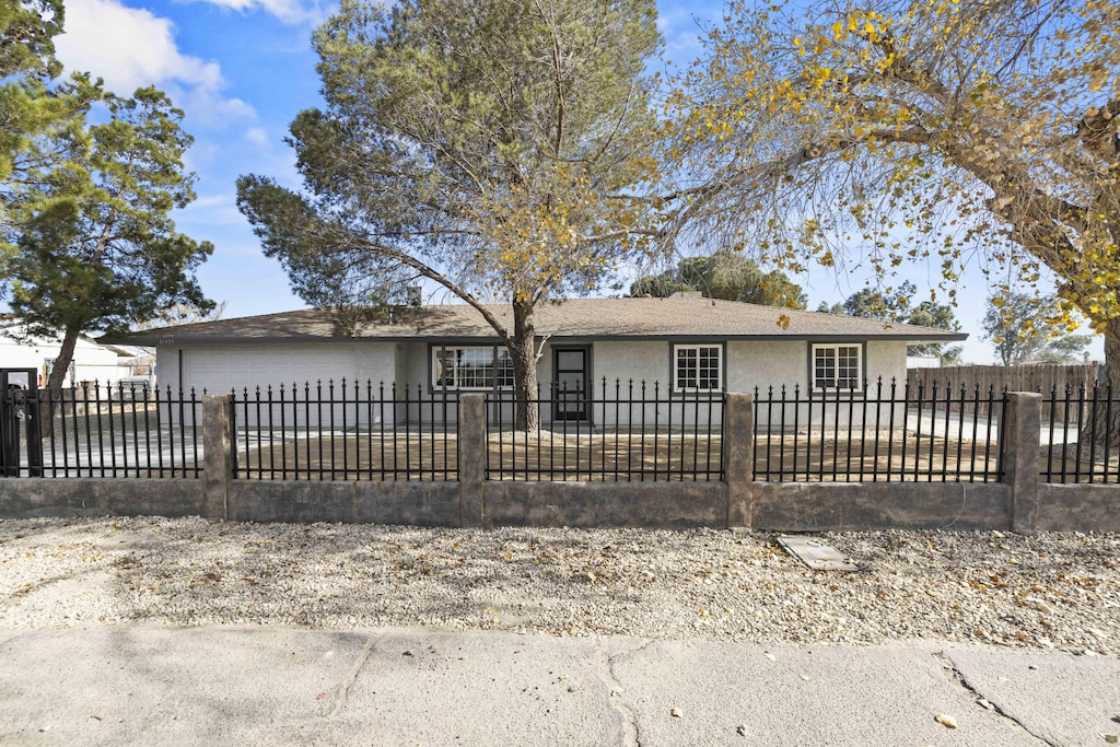 single story home featuring a garage